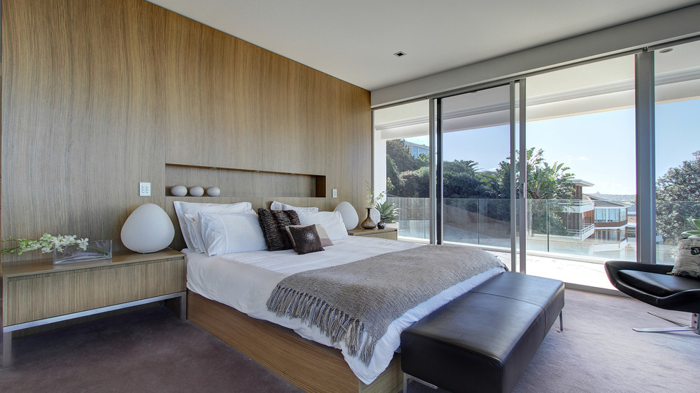 Photo of a contemporary bedroom in Sydney with carpet.