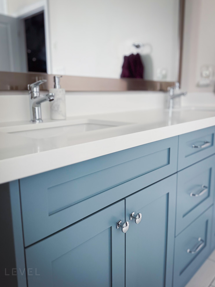 Inspiration for a large contemporary master bathroom in Toronto with shaker cabinets, blue cabinets, an undermount sink, engineered quartz benchtops, a double vanity and a freestanding vanity.