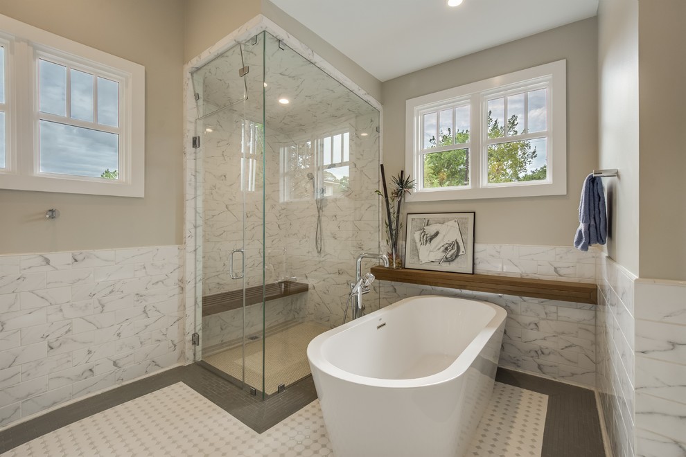 This is an example of a mid-sized midcentury master bathroom with shaker cabinets, grey cabinets, a freestanding tub, a corner shower, a one-piece toilet, multi-coloured tile, beige walls, an undermount sink, white floor, a hinged shower door and white benchtops.