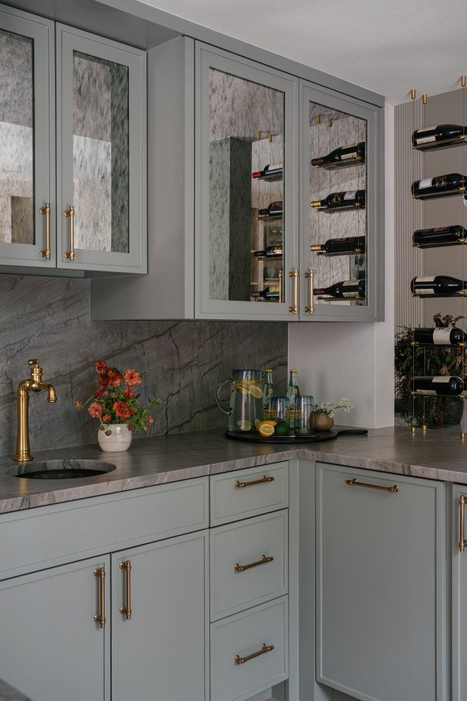 Example of a transitional home bar design in Dallas