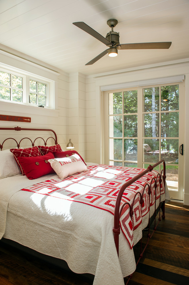 Inspiration for a mid-sized transitional guest bedroom in Toronto with white walls and medium hardwood floors.