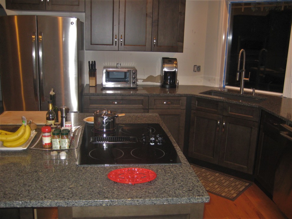 Inspiration for a transitional medium tone wood floor kitchen remodel in Seattle with an undermount sink, gray cabinets and stainless steel appliances