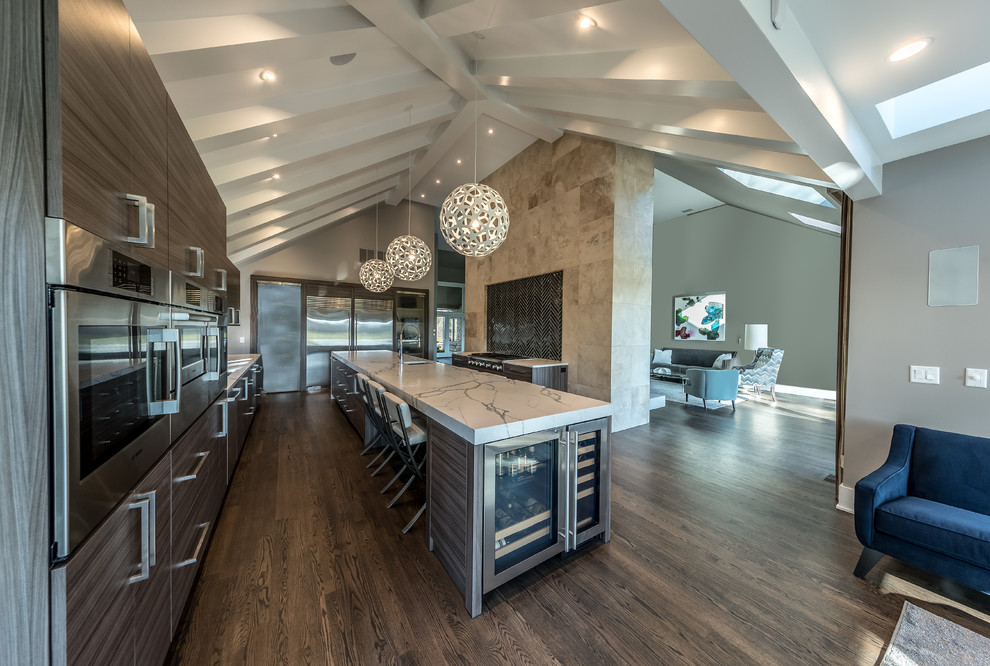 Inspiration for a large modern open plan kitchen in Chicago with an undermount sink, flat-panel cabinets, medium wood cabinets, marble benchtops, black splashback, glass tile splashback, stainless steel appliances, medium hardwood floors, with island and brown floor.