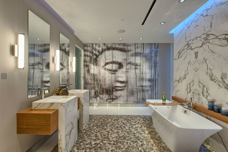 This is an example of a large contemporary master wet room bathroom in Los Angeles with open cabinets, medium wood cabinets, a freestanding tub, a two-piece toilet, white tile, stone slab, grey walls, pebble tile floors, an integrated sink, marble benchtops, multi-coloured floor and a hinged shower door.
