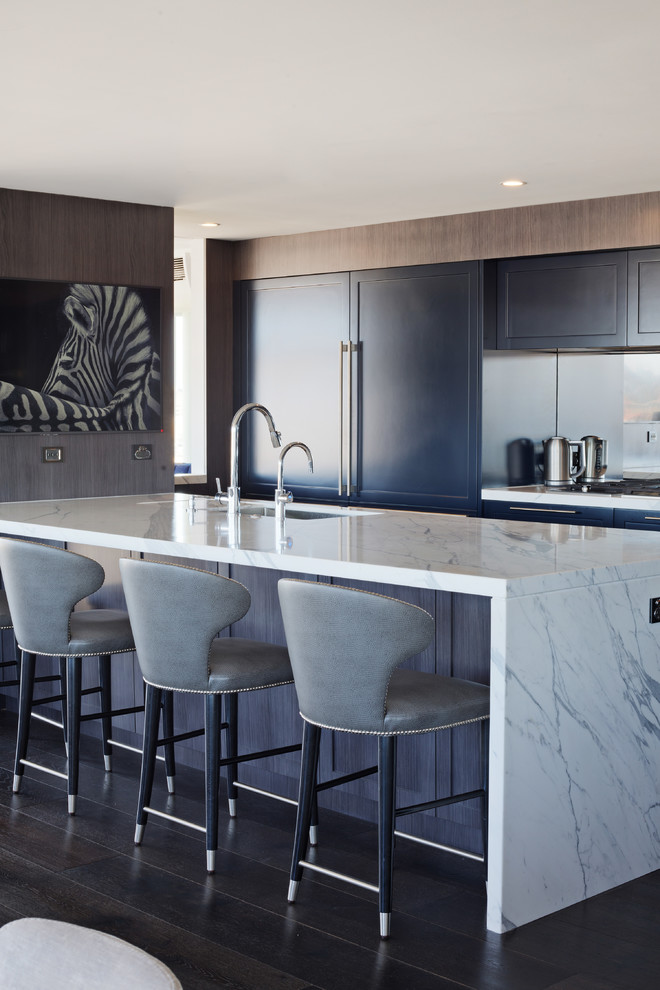 Inspiration for a large transitional galley open plan kitchen in Sydney with an undermount sink, shaker cabinets, mirror splashback, with island, grey benchtop, blue cabinets, marble benchtops, stainless steel appliances, dark hardwood floors and black floor.