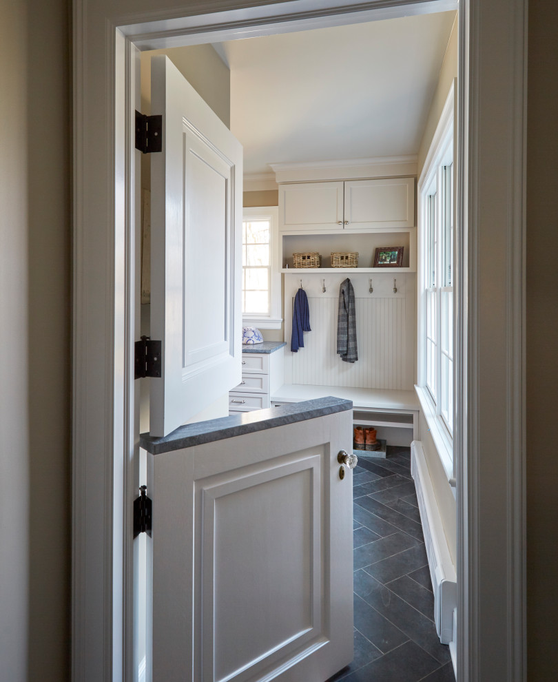 Mid-sized traditional mudroom in Chicago with beige walls, slate floors and grey floor.