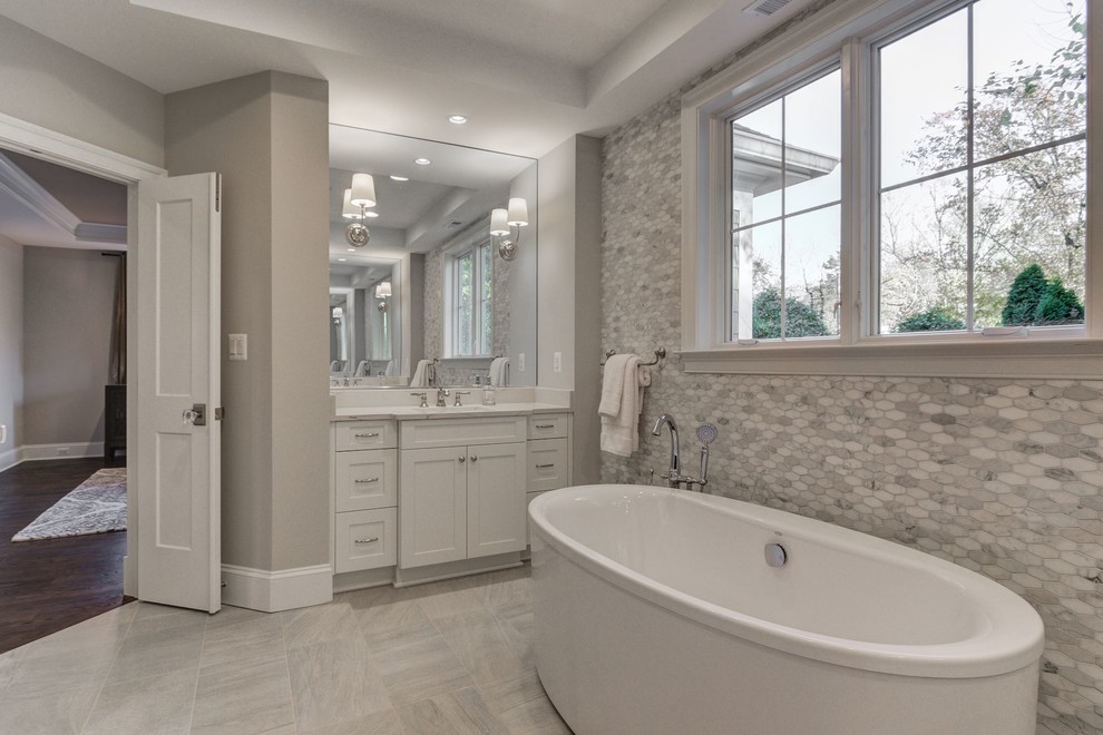 Large transitional master bathroom in Baltimore with a freestanding tub, a curbless shower, multi-coloured tile and engineered quartz benchtops.
