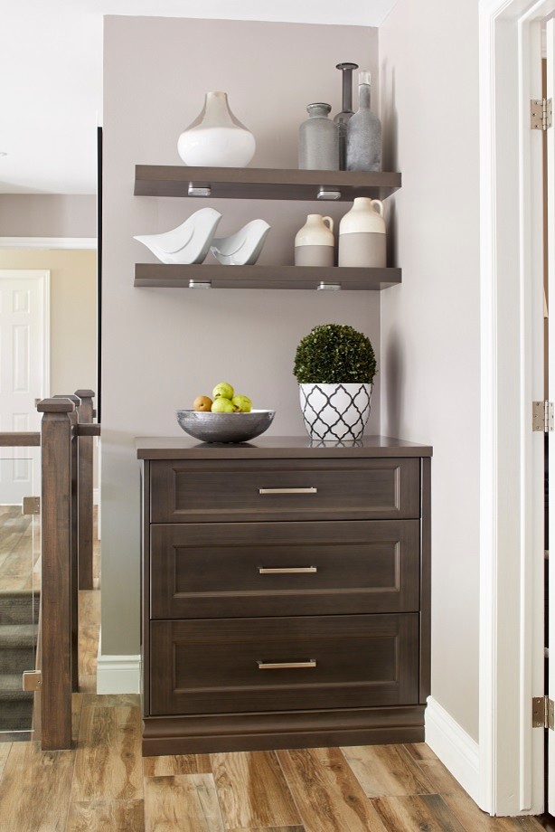 Mid-sized transitional l-shaped light wood floor and multicolored floor eat-in kitchen photo in Toronto with a farmhouse sink, shaker cabinets, dark wood cabinets, granite countertops, gray backsplash, stainless steel appliances, an island and white countertops