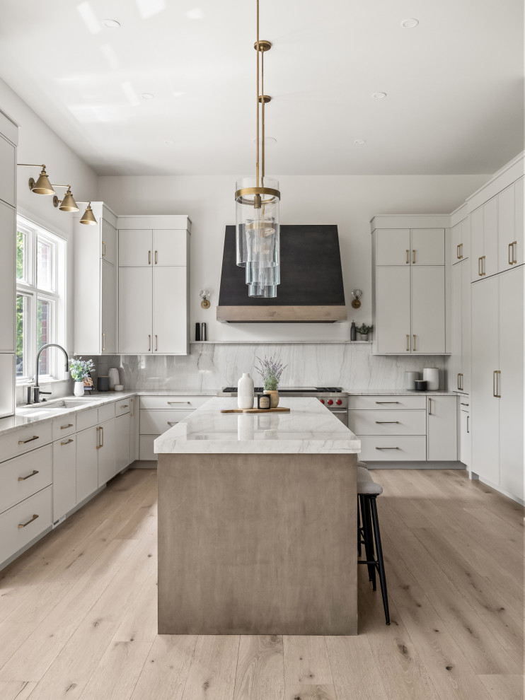 Example of a large transitional u-shaped light wood floor and beige floor eat-in kitchen design in Detroit with an undermount sink, quartz countertops, quartz backsplash, an island, white countertops, white cabinets, white backsplash and paneled appliances