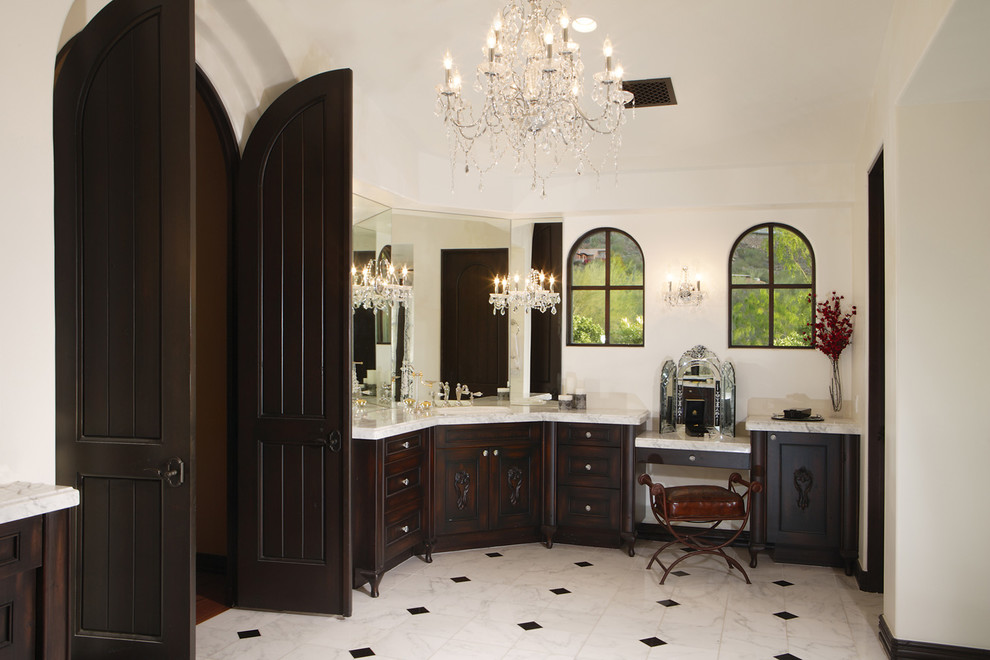 Large traditional master bathroom in Phoenix with an integrated sink, furniture-like cabinets, dark wood cabinets, marble benchtops, white tile, stone tile, white walls, marble floors and a claw-foot tub.