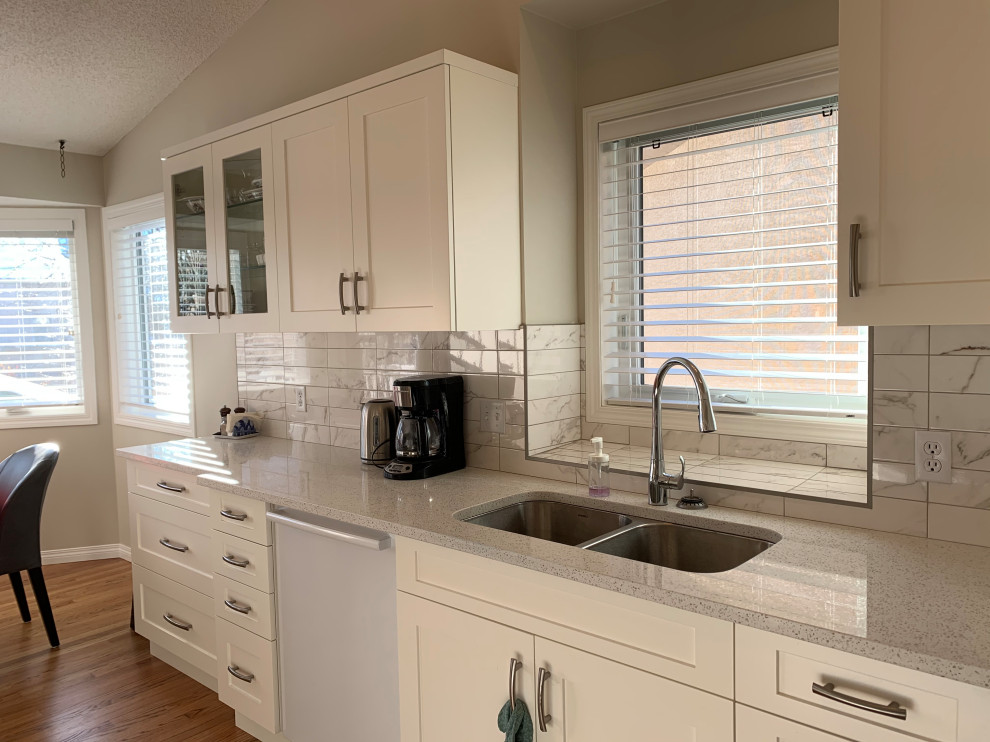Transitional home design photo in Calgary
