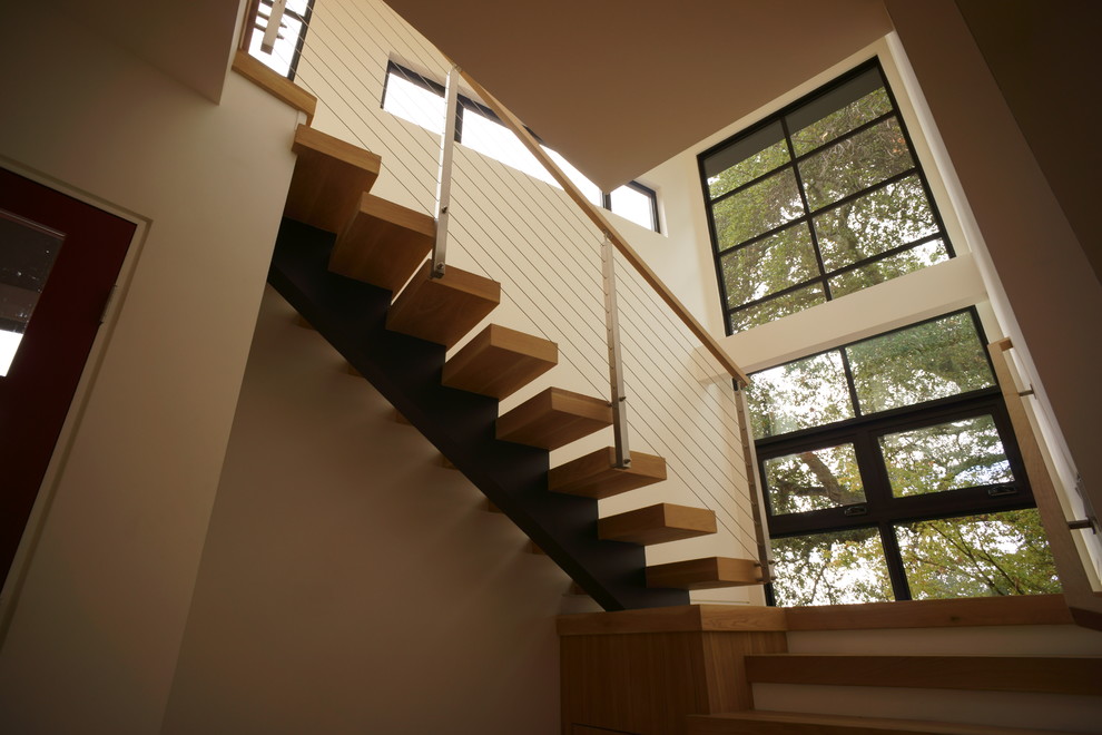Inspiration for a mid-sized modern wood floating staircase in Denver with open risers.