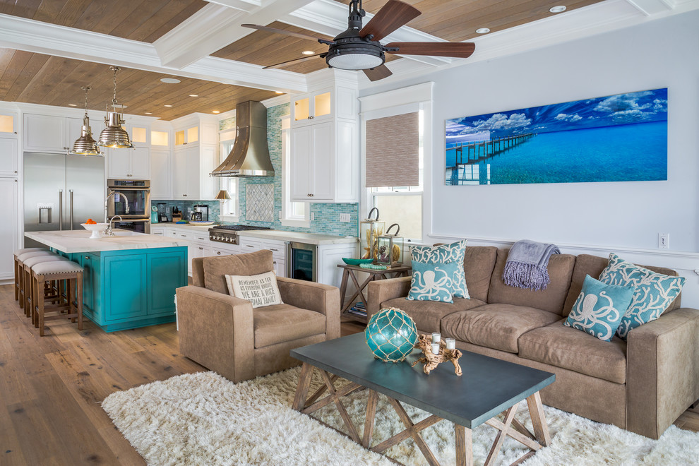 Photo of a mid-sized beach style living room in San Diego with light hardwood floors and grey floor.