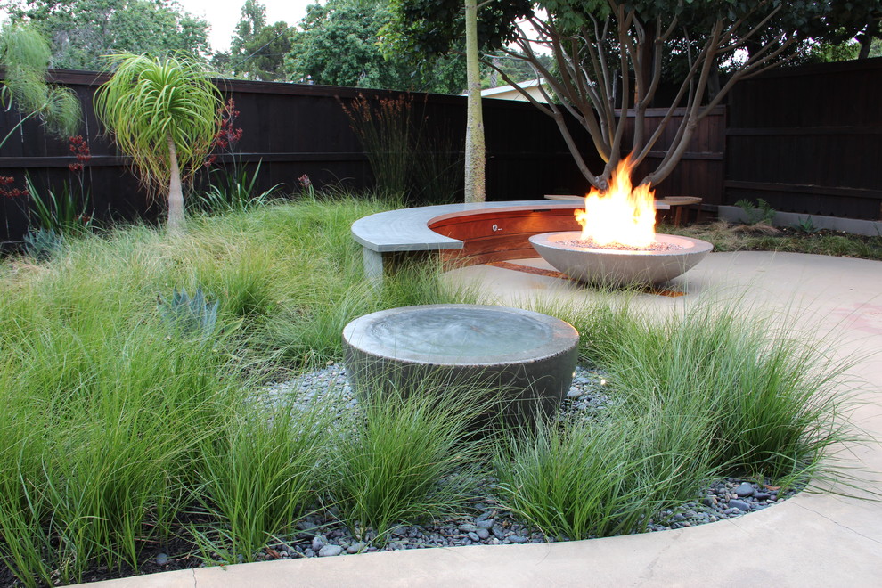 Design ideas for a mid-sized modern backyard patio in San Luis Obispo with a water feature, concrete slab and no cover.