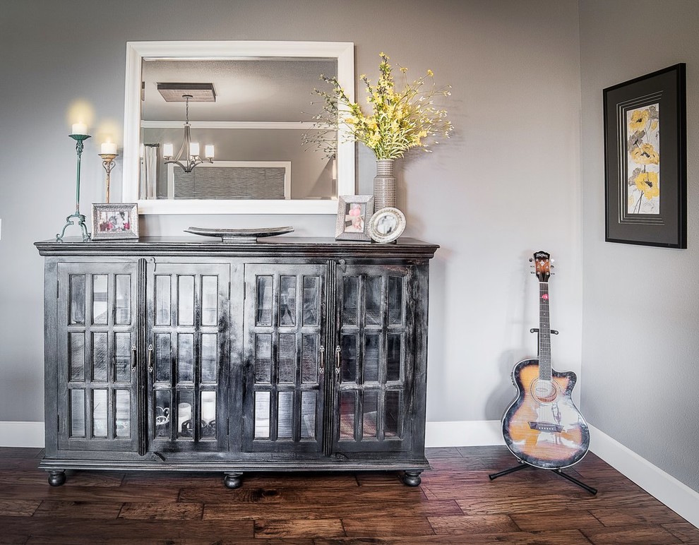 Inspiration for a mid-sized transitional dark wood floor and brown floor dining room remodel with gray walls and no fireplace