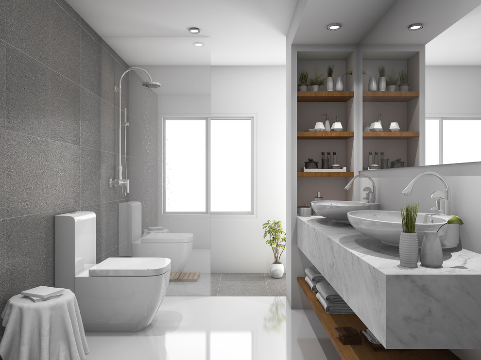 This is an example of a large contemporary master bathroom in Melbourne with open cabinets, dark wood cabinets, an open shower, a one-piece toilet, gray tile, porcelain tile, grey walls, porcelain floors, a vessel sink, solid surface benchtops, grey floor and an open shower.