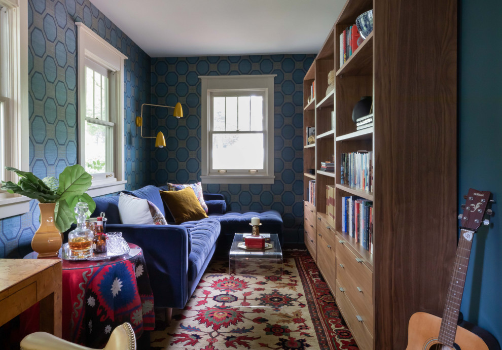 Home office - mid-sized eclectic freestanding desk medium tone wood floor, brown floor and wallpaper home office idea in Chicago with blue walls and no fireplace