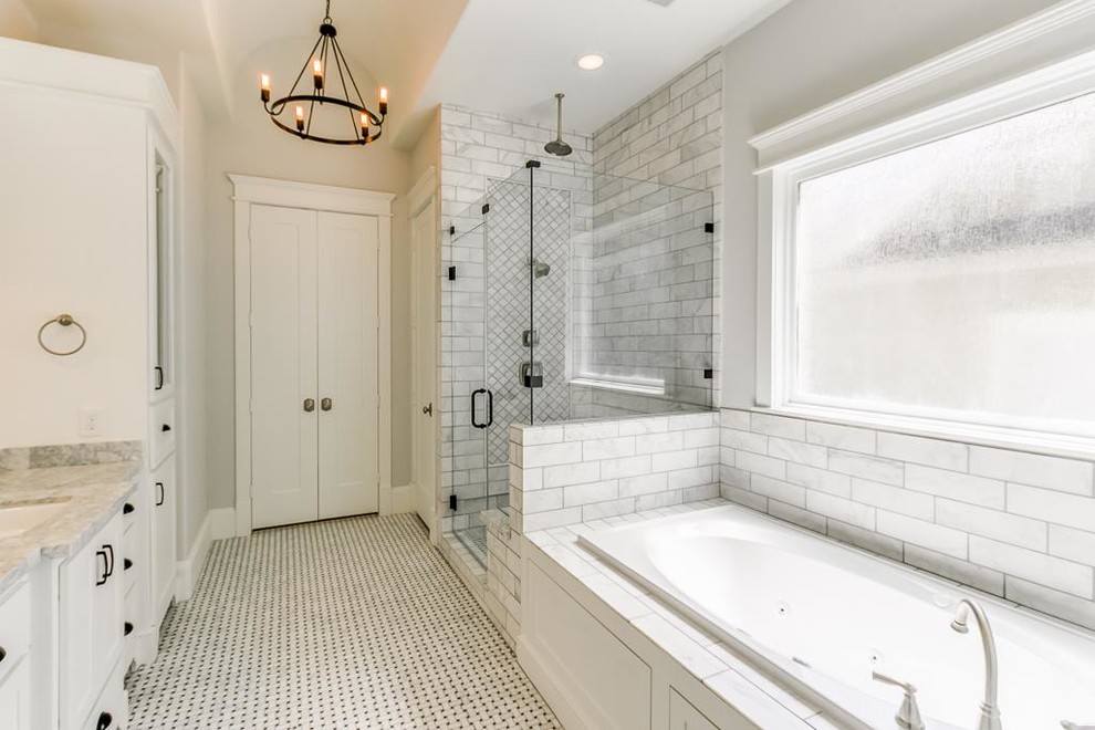 Mid-sized traditional master bathroom in Houston with raised-panel cabinets, white cabinets, a drop-in tub, an open shower, a two-piece toilet, white tile, marble, white walls, mosaic tile floors, an undermount sink, marble benchtops, white floor and a hinged shower door.