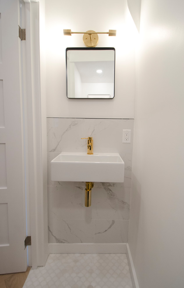 Inspiration for a small contemporary powder room in Toronto with a wall-mount toilet, gray tile, marble, white walls, marble floors, a wall-mount sink and white floor.