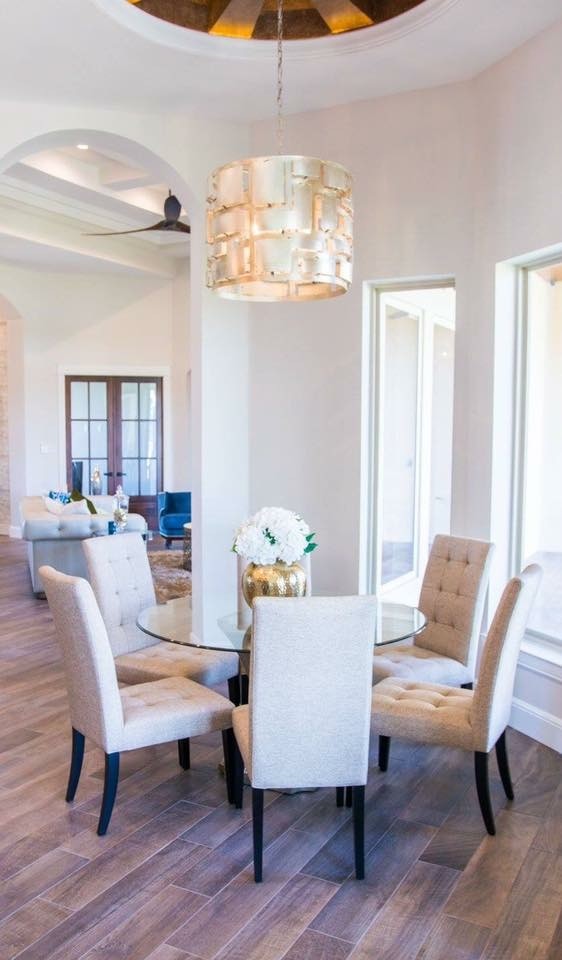 Kitchen/dining room combo - mid-sized transitional medium tone wood floor and brown floor kitchen/dining room combo idea with beige walls