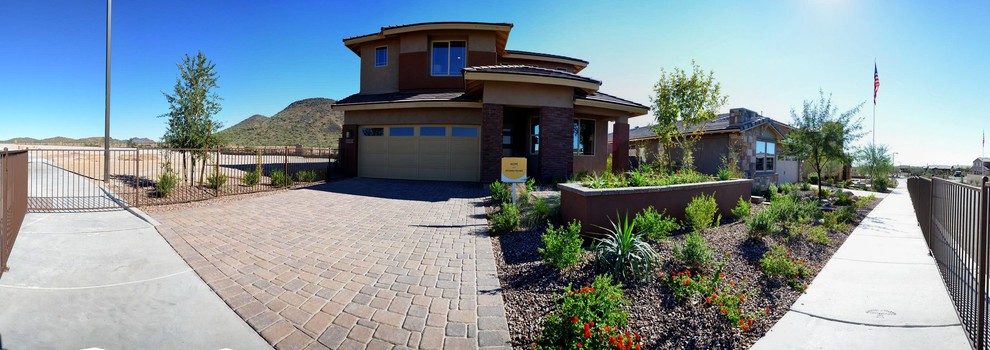 Mid-sized contemporary two-storey stucco beige exterior in Phoenix with a gable roof.