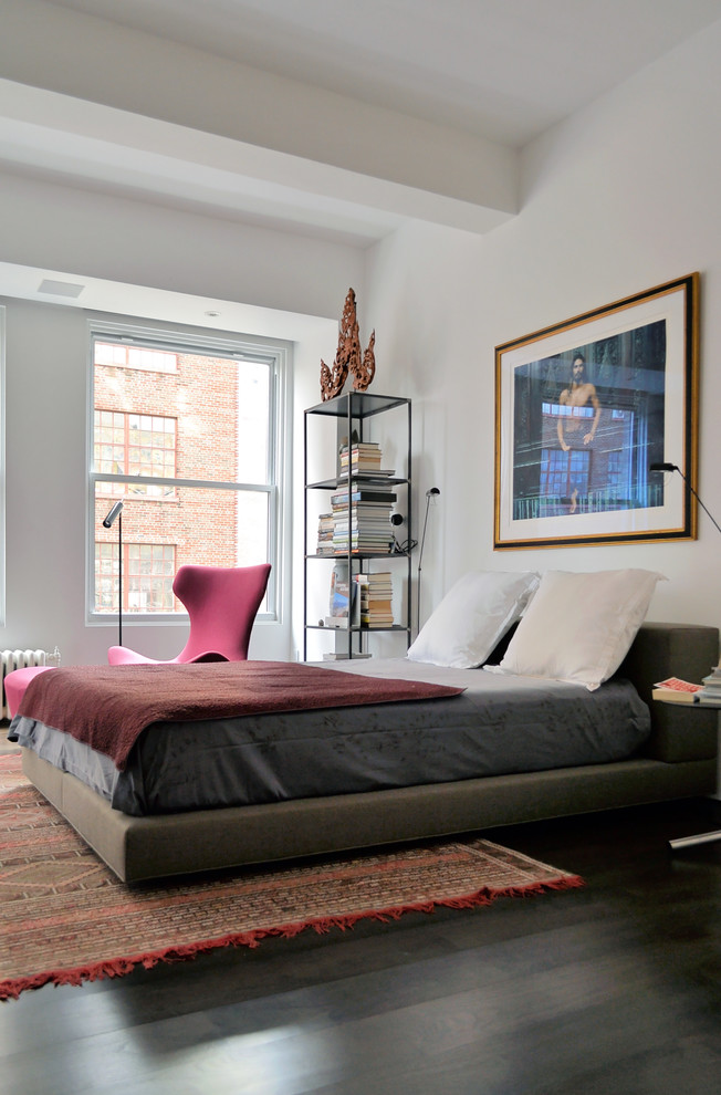 Eclectic bedroom in New York with white walls.