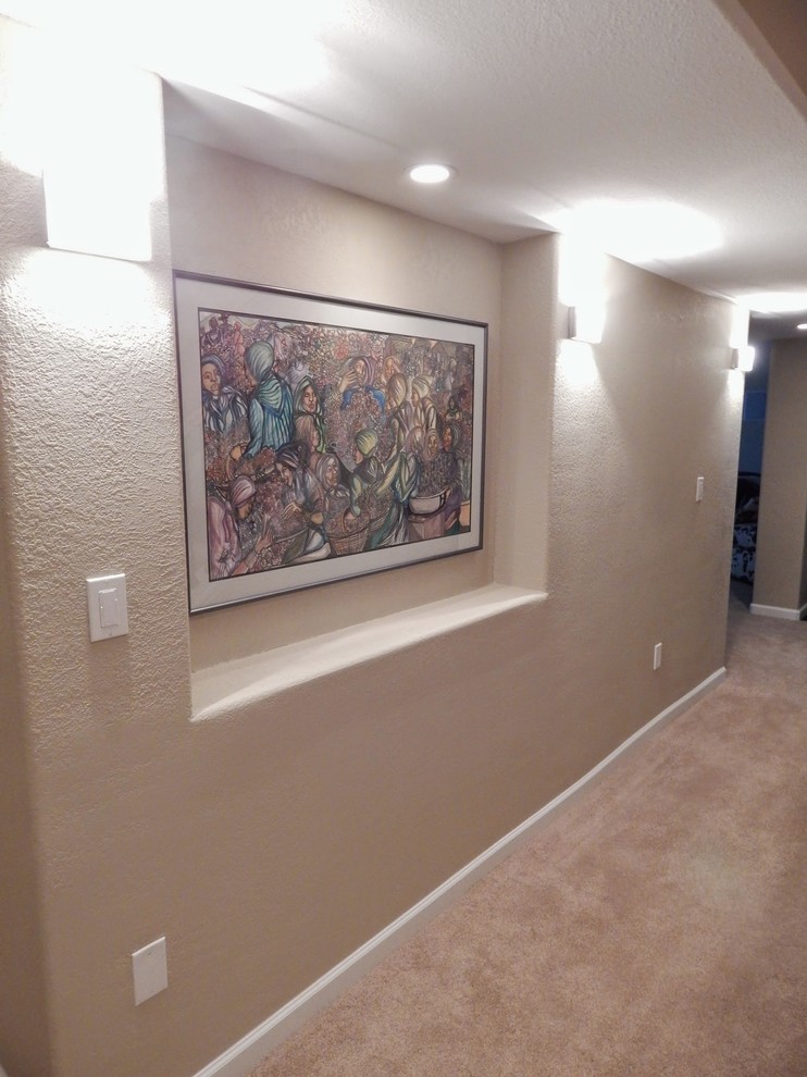 Large transitional hallway in Denver with beige walls, carpet and beige floor.