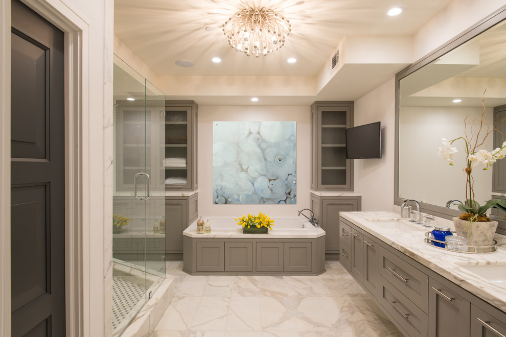 Inspiration for a mid-sized contemporary master bathroom in Houston with an undermount sink, grey cabinets, marble benchtops, a drop-in tub, a double shower, white tile, stone tile, white walls, marble floors and shaker cabinets.
