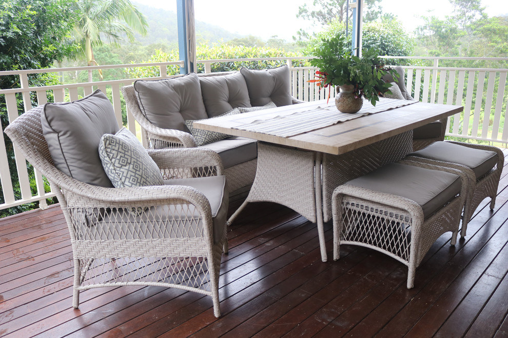 This is an example of a mid-sized transitional balcony in Gold Coast - Tweed with a pergola and wood railing.