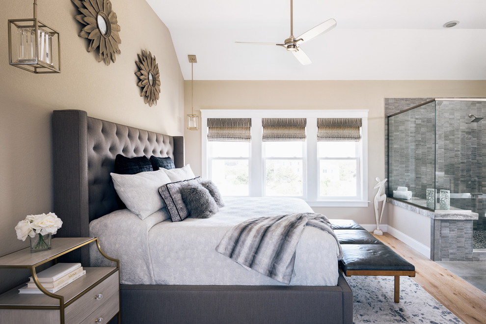 Mid-sized minimalist master light wood floor and brown floor bedroom photo in Other with beige walls and a two-sided fireplace