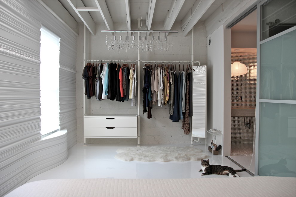 Design ideas for a contemporary storage and wardrobe in Philadelphia with white cabinets and ceramic floors.