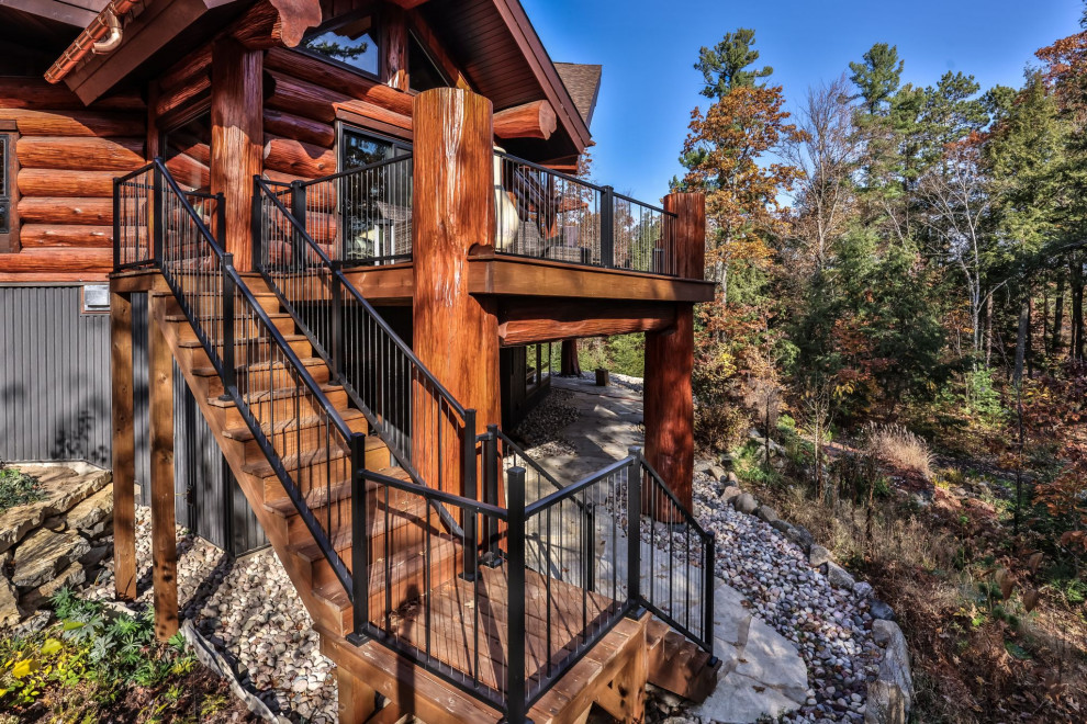 Inspiration for a huge rustic ground level metal railing deck remodel