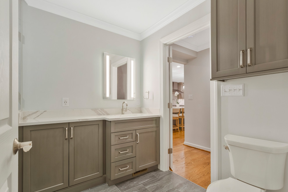Inspiration for a mid-sized transitional master bathroom in Baltimore with recessed-panel cabinets, a corner shower, mosaic tile, a drop-in sink, engineered quartz benchtops, a hinged shower door, a shower seat, a single vanity and a built-in vanity.