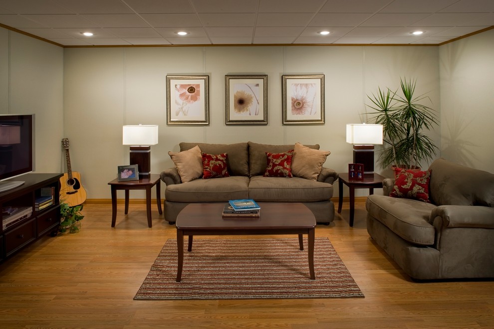 Mid-sized modern fully buried basement in Boston with beige walls, medium hardwood floors, no fireplace and beige floor.