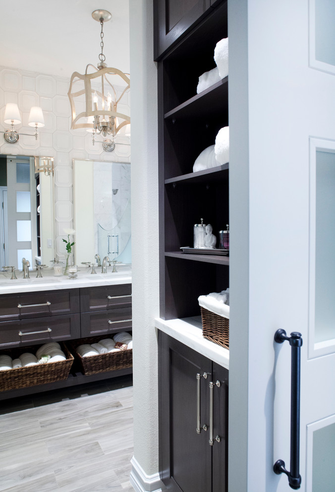 Design ideas for a contemporary bathroom in Las Vegas with shaker cabinets, dark wood cabinets, an open shower, a one-piece toilet, white tile, ceramic tile, yellow walls, porcelain floors, an undermount sink and marble benchtops.