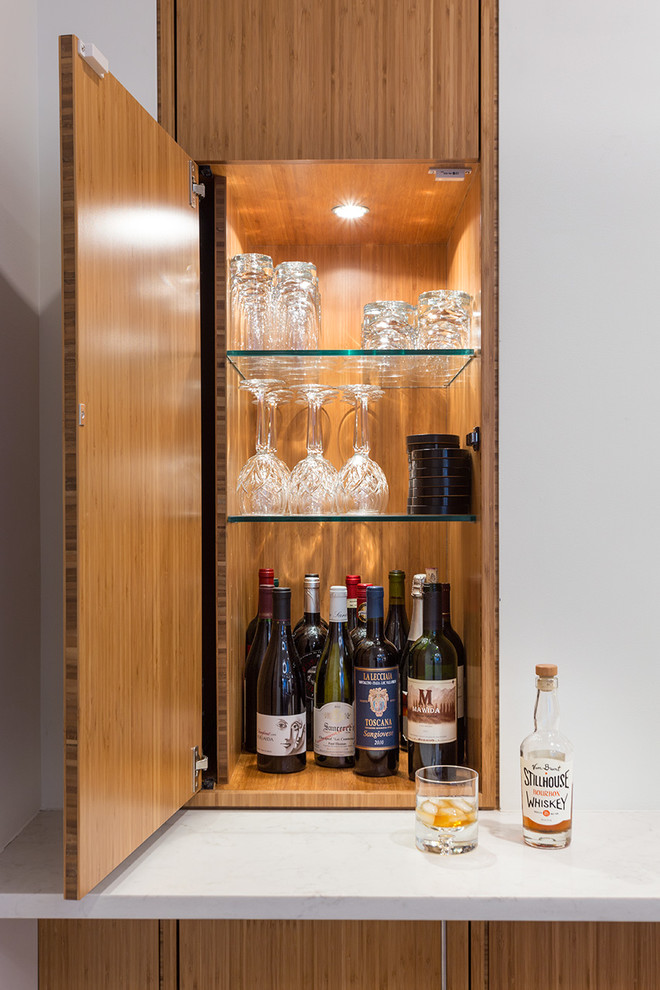 This is an example of a contemporary home bar in New York.