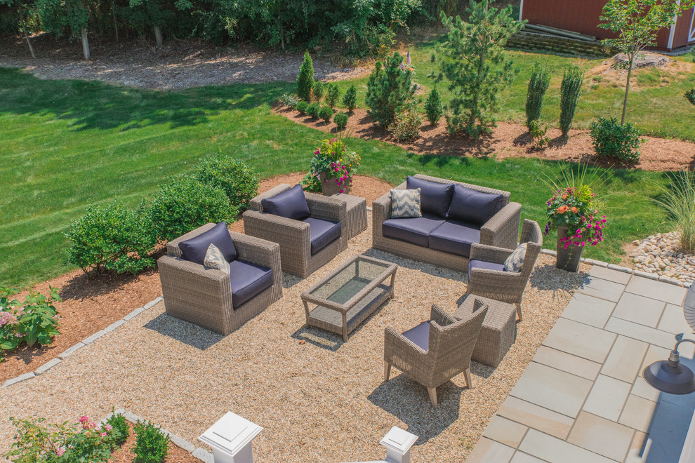 Design ideas for a mid-sized beach style backyard patio in Bridgeport with gravel and no cover.