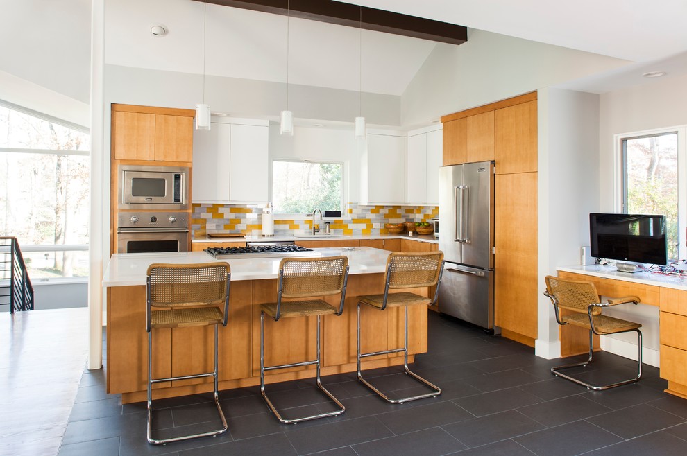 Eat-in kitchen - mid-century modern l-shaped eat-in kitchen idea in Atlanta with quartzite countertops, yellow backsplash, glass tile backsplash, stainless steel appliances, a single-bowl sink, flat-panel cabinets and light wood cabinets