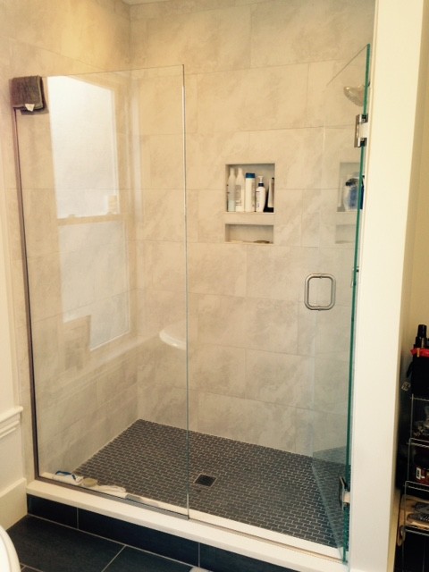 Example of a mid-sized transitional master gray tile and porcelain tile porcelain tile corner shower design in Boston with an undermount sink, flat-panel cabinets, dark wood cabinets and marble countertops