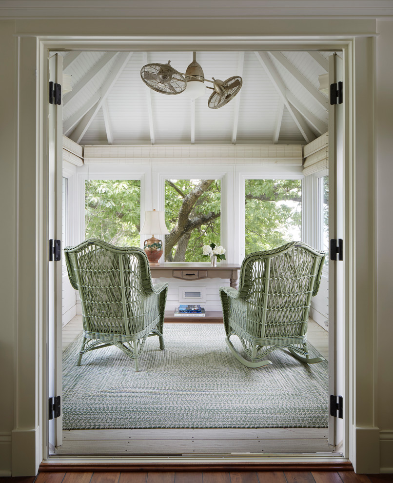 Photo of a traditional sunroom in Denver with light hardwood floors, no fireplace and a standard ceiling.