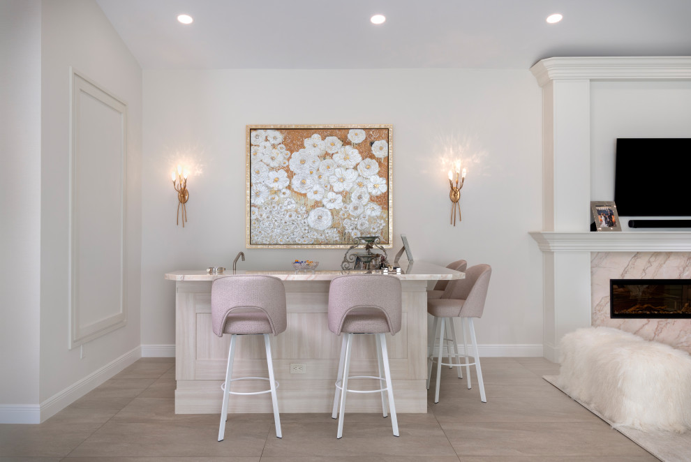 Example of a transitional gray floor home bar design in Miami with beige countertops