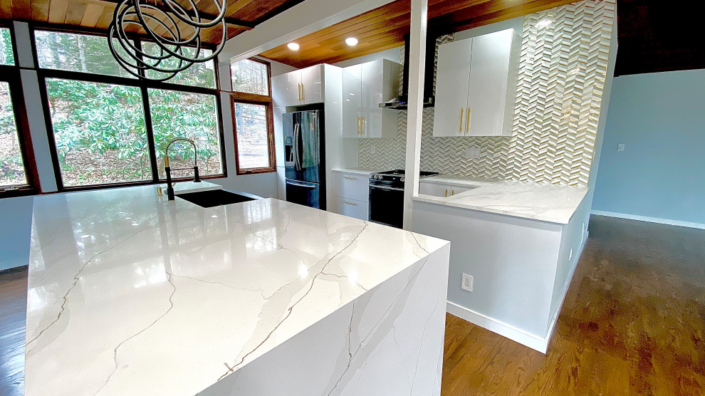 Mid-sized midcentury galley eat-in kitchen in New York with a farmhouse sink, flat-panel cabinets, white cabinets, quartzite benchtops, white splashback, marble splashback, stainless steel appliances, medium hardwood floors, with island, brown floor, white benchtop and wood.