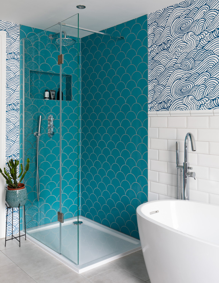 Inspiration for a large kids bathroom in London with grey floor, blue walls, porcelain floors, wallpaper, flat-panel cabinets, blue cabinets, a freestanding tub, a corner shower, a one-piece toilet, white tile, porcelain tile, an open shower, a niche, a single vanity and a freestanding vanity.