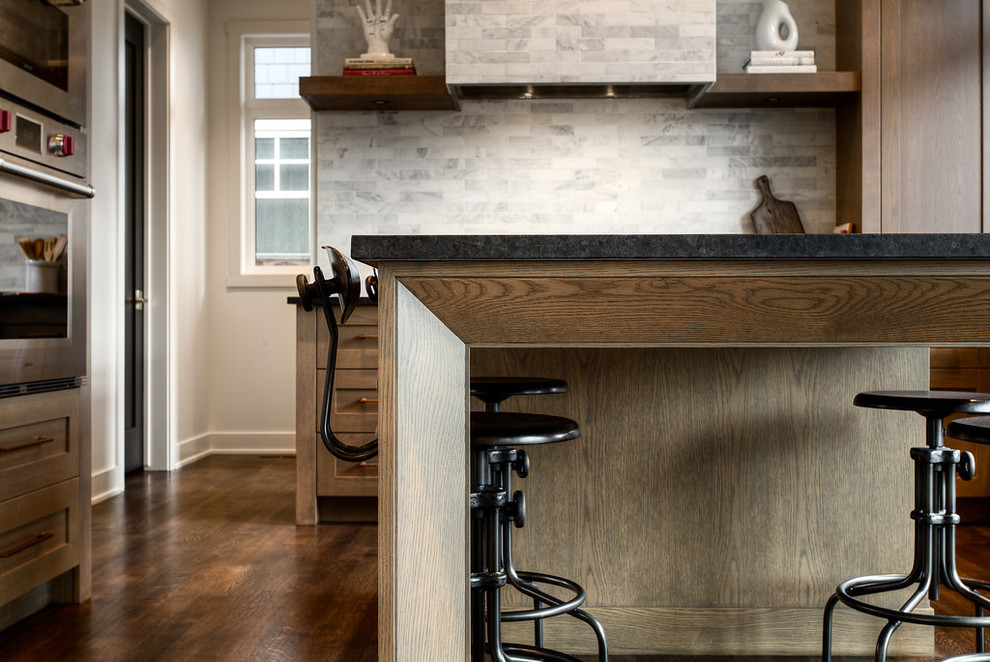Example of a transitional kitchen design in Calgary