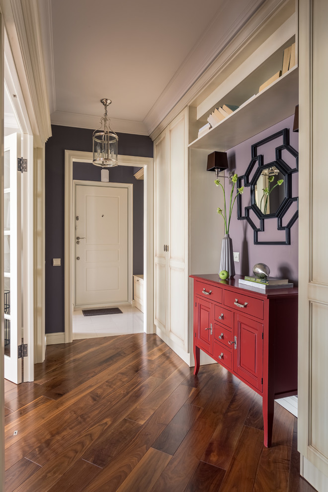 This is an example of a transitional hallway in Moscow with purple walls, medium hardwood floors and brown floor.