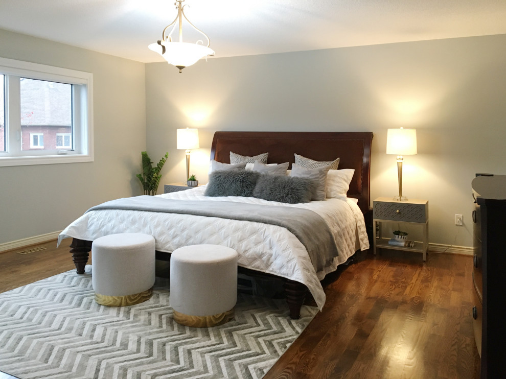 Example of a transitional bedroom design in Toronto