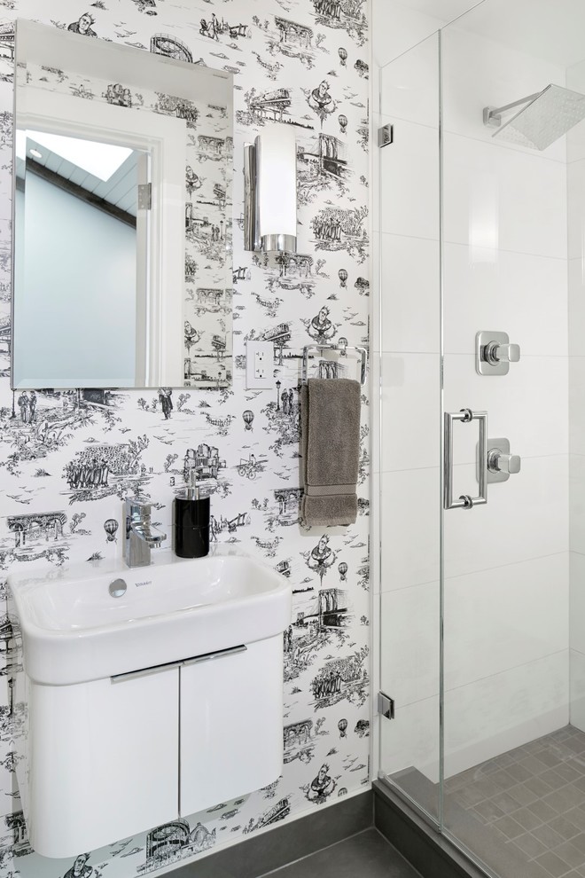 Inspiration for a contemporary 3/4 bathroom in New York with flat-panel cabinets, white cabinets, white tile, multi-coloured walls, porcelain floors and a hinged shower door.