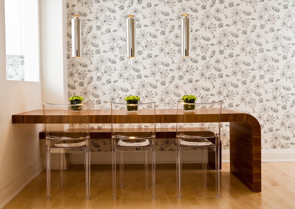 Modern dining room in Toronto with multi-coloured walls, light hardwood floors and beige floor.
