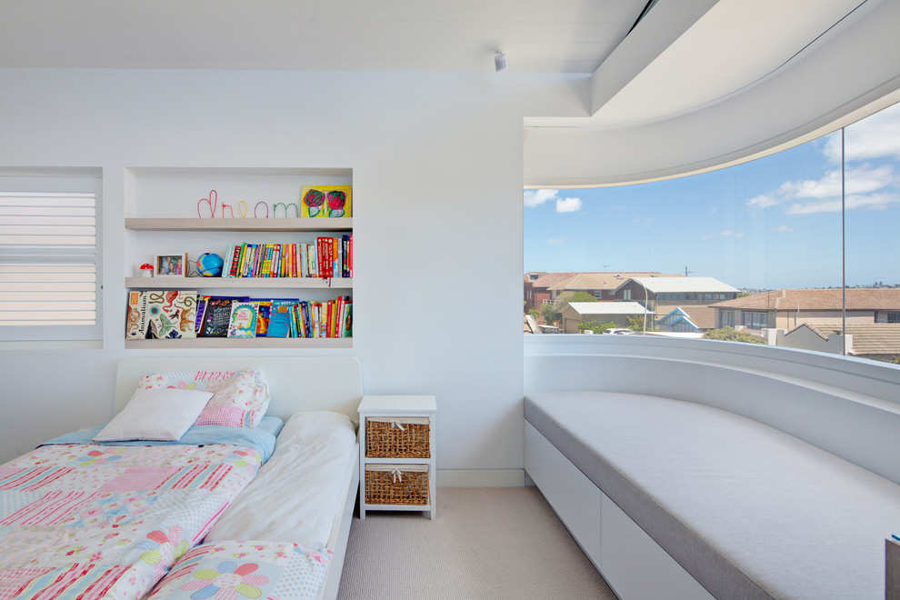 Inspiration for an expansive modern loft-style bedroom in Sydney with white walls and light hardwood floors.