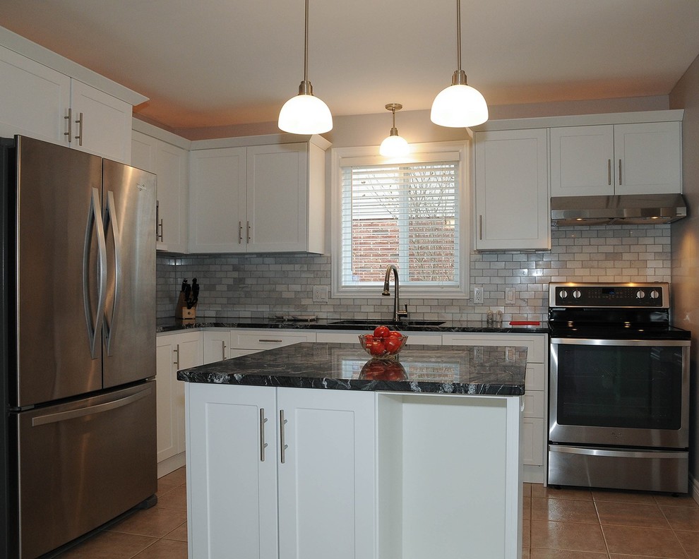 Example of a transitional kitchen design in Calgary